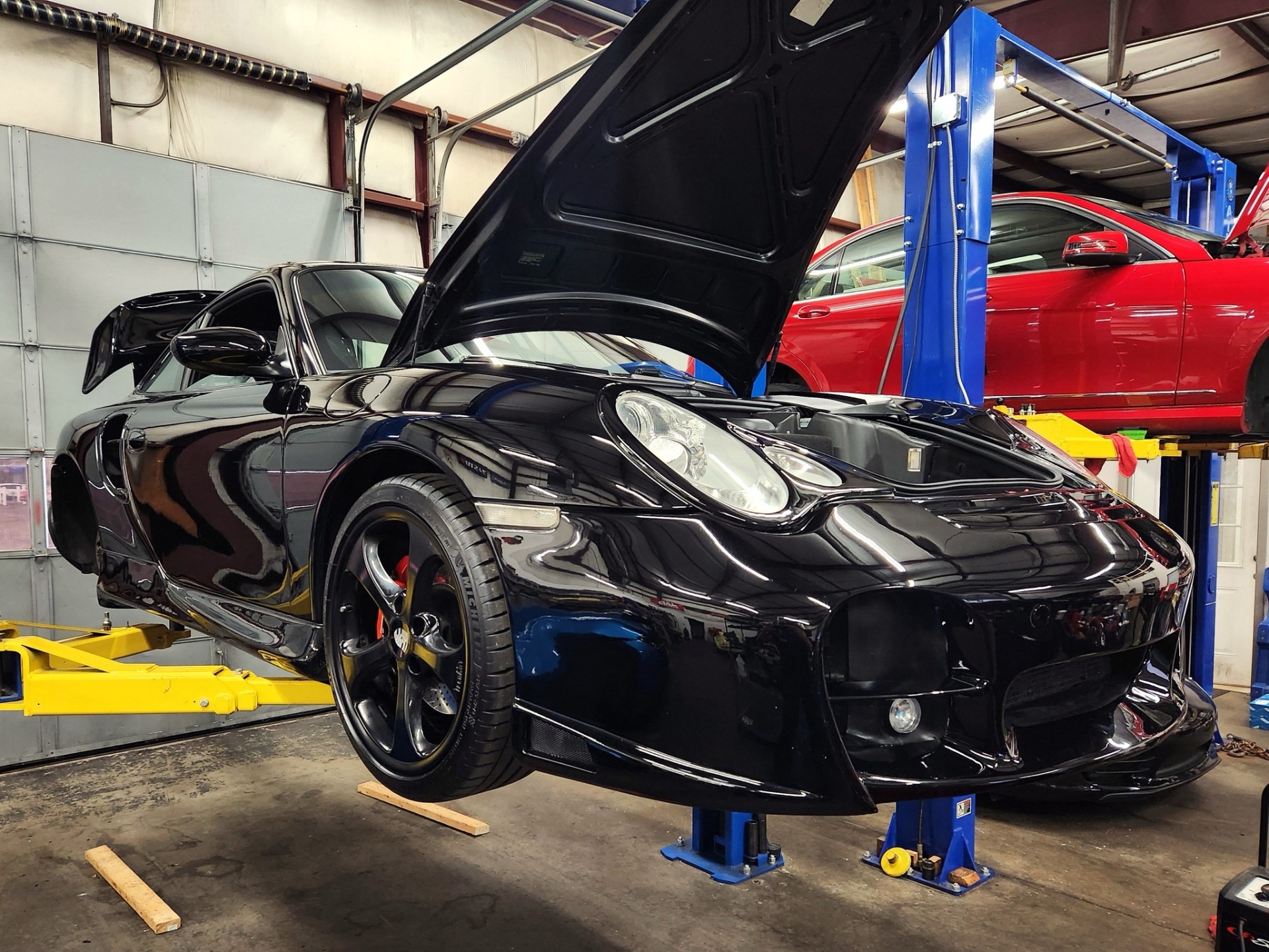 Black Porsche 996 Turbo on the lift